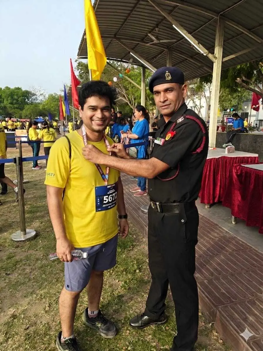 Abhinandh receiving an award.