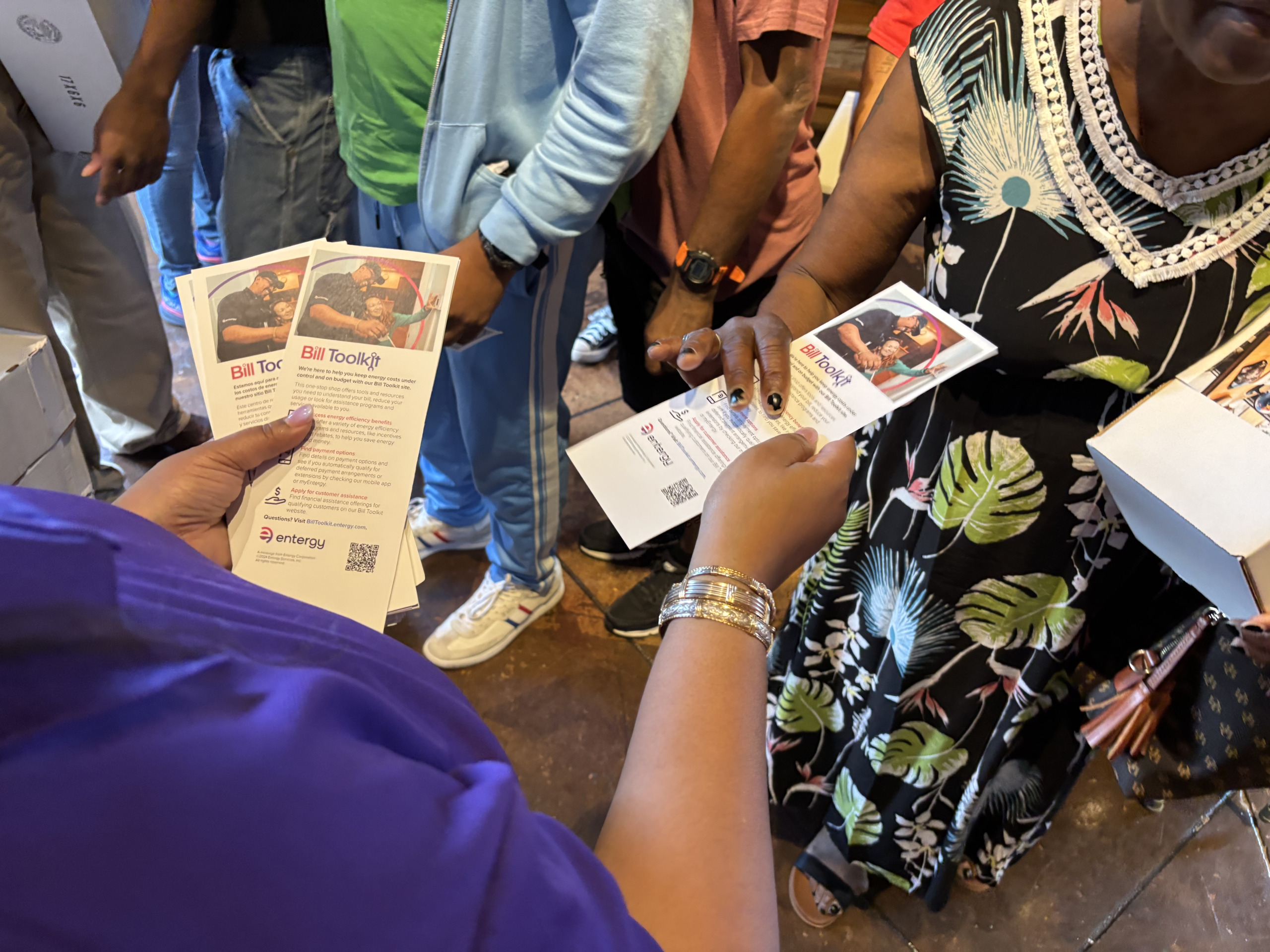 Entergy volunteer handing out pamphlets on their Bill Toolkit