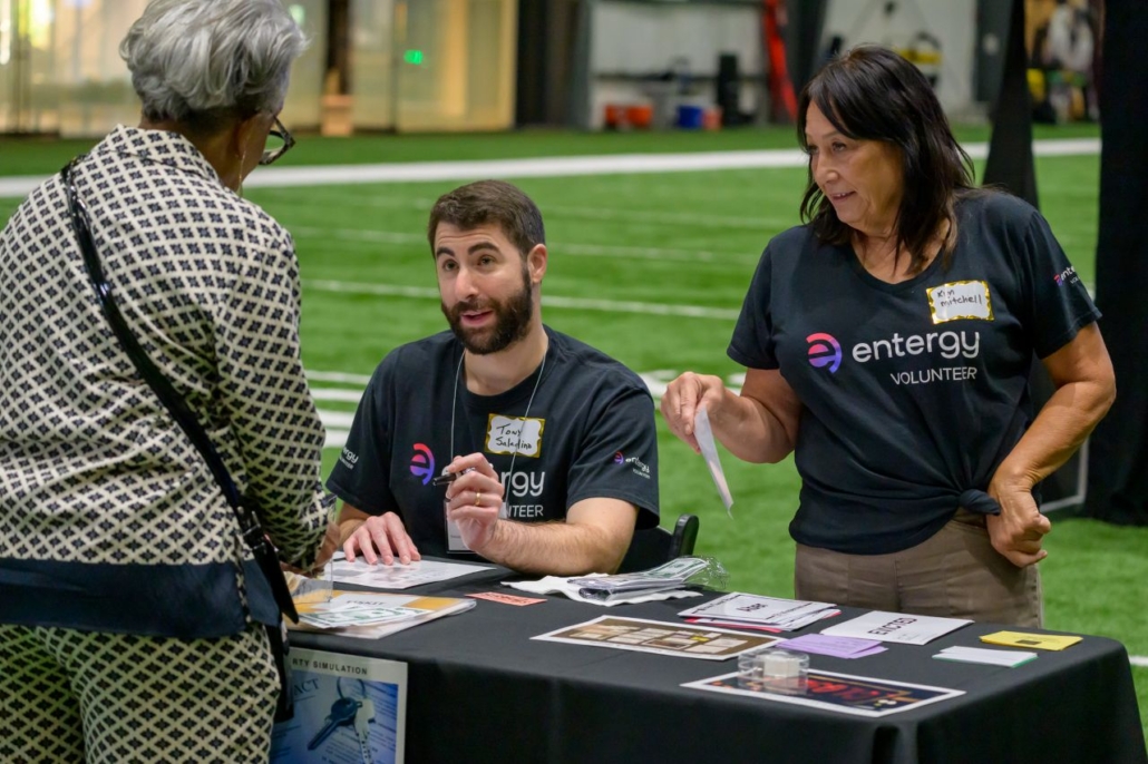 Participant and volunteers at poverty simulation