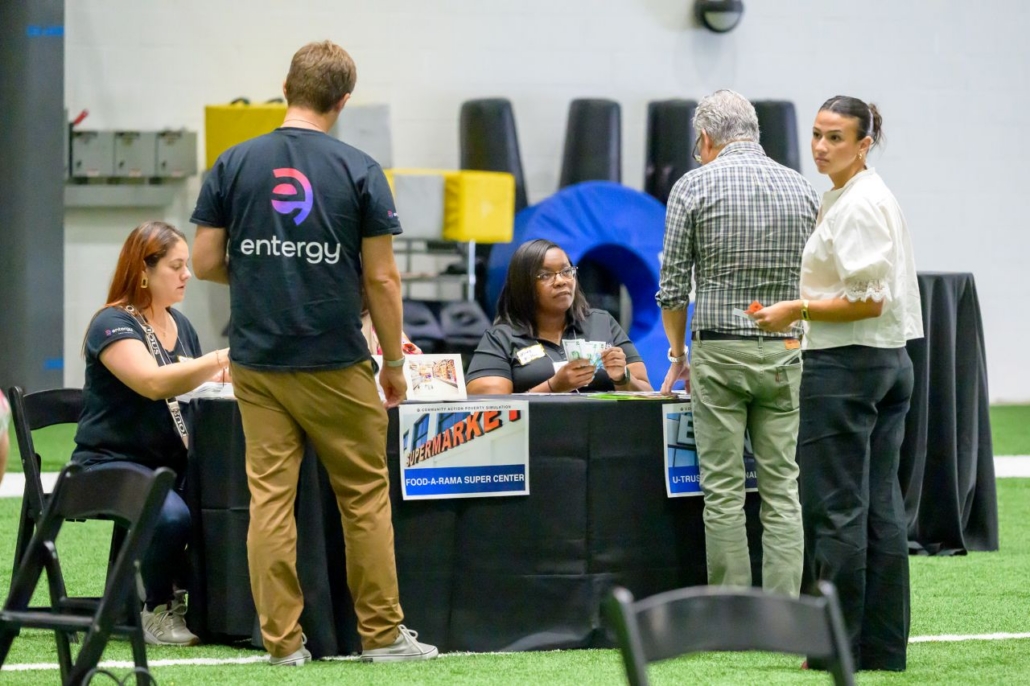 Participant and volunteers at poverty simulation