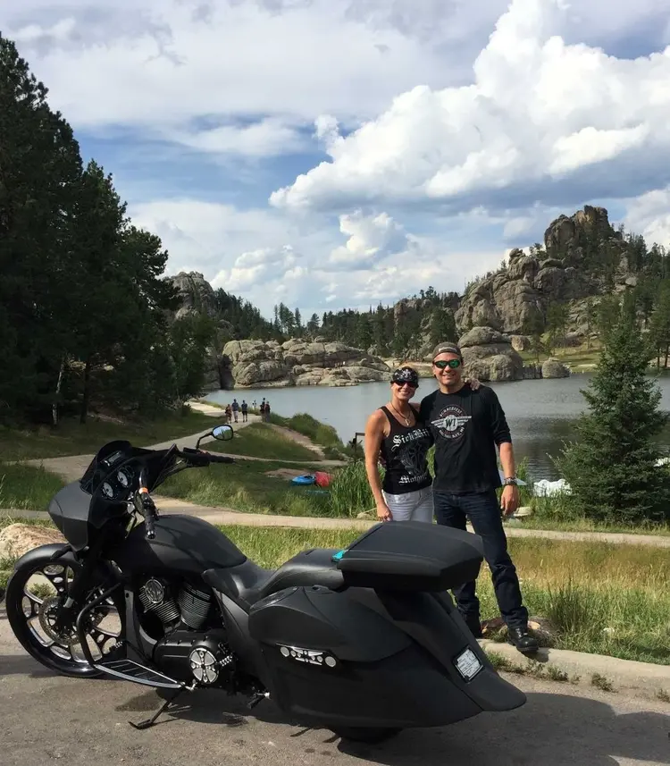 Chelley and partner with motorcycle