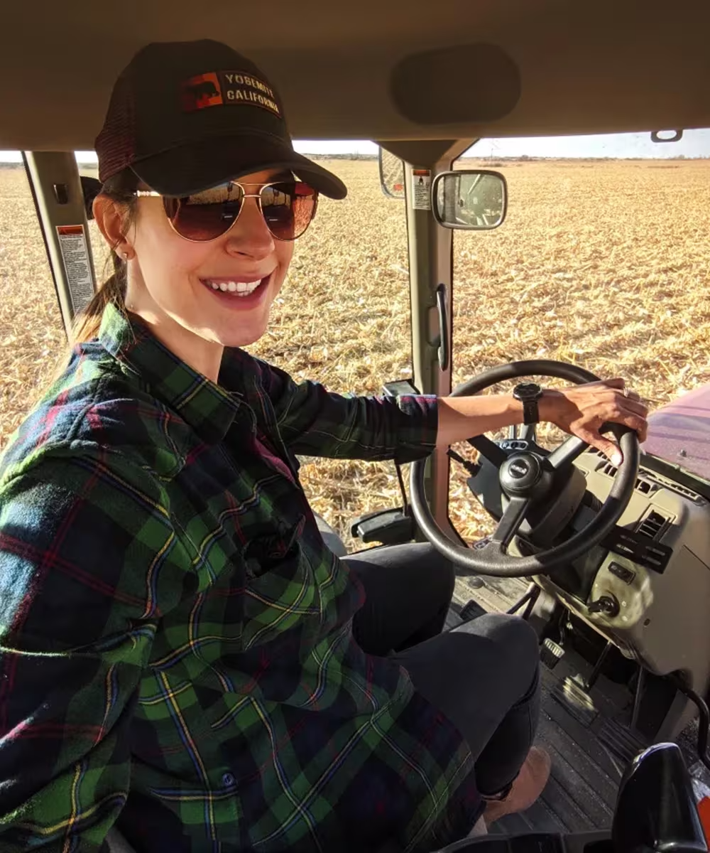 person driving tractor