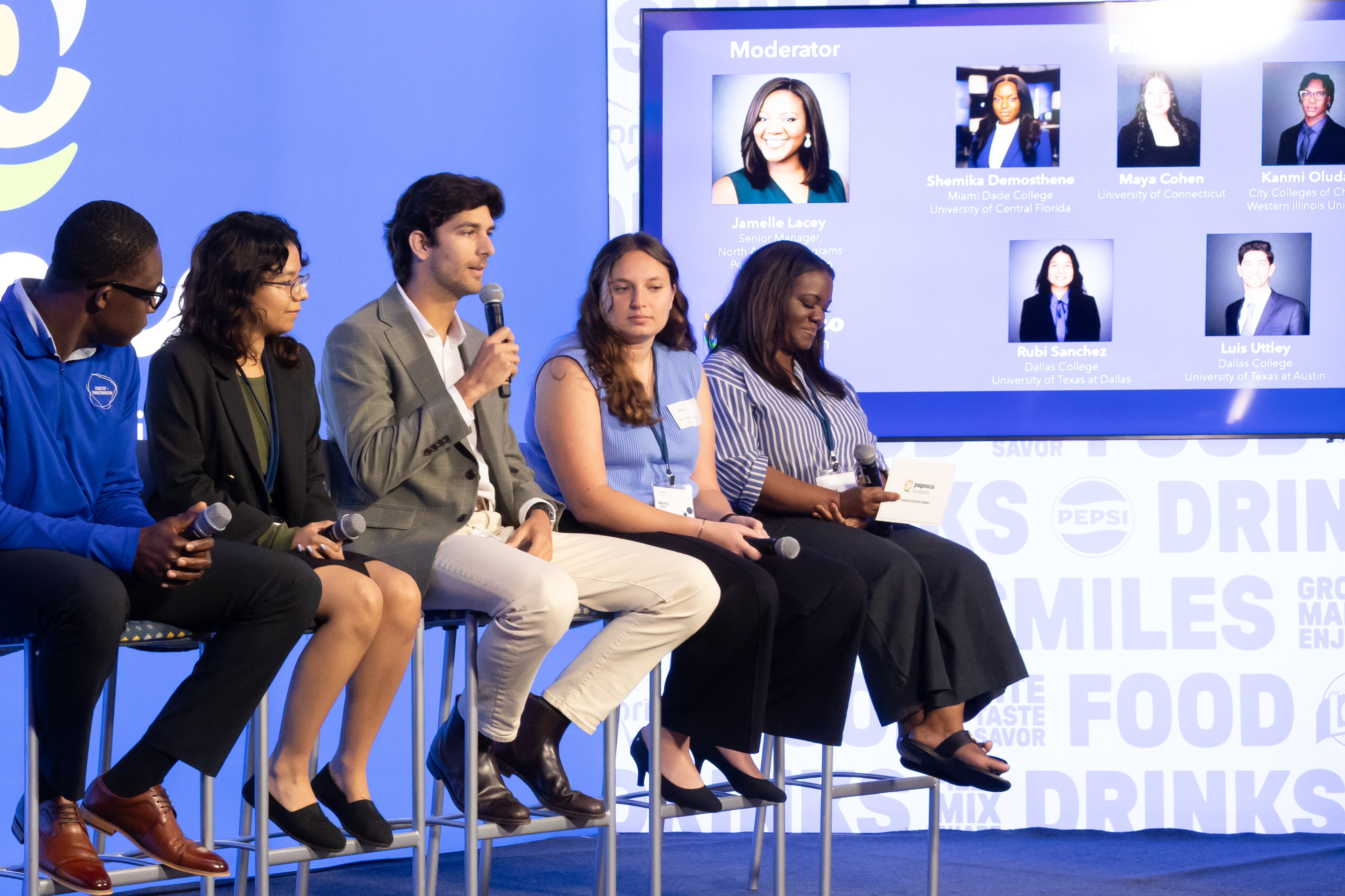A panel seated on a stage