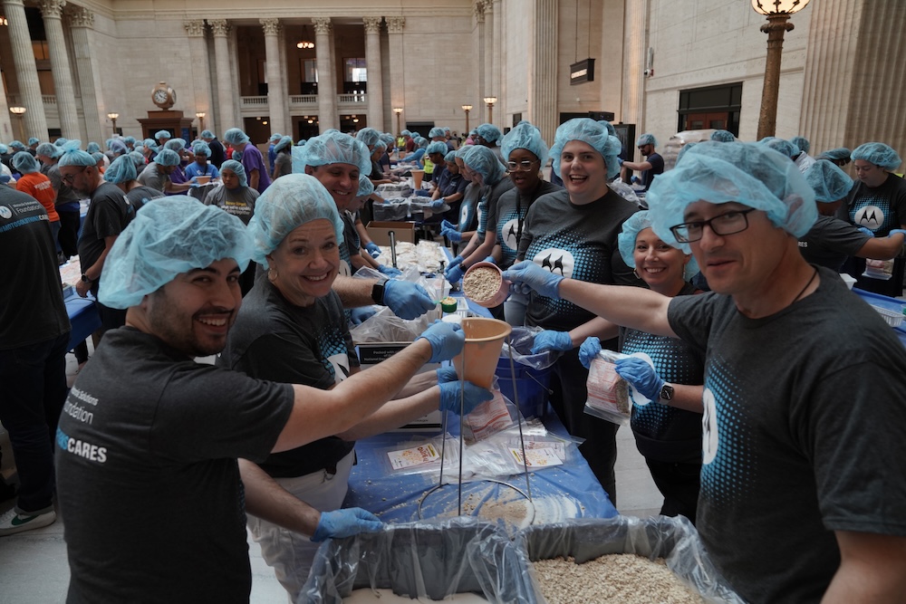 Volunteers packing food