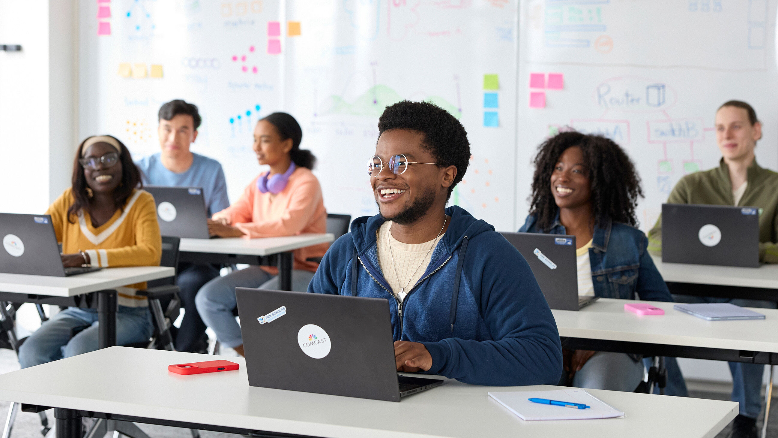 people working in a classroom
