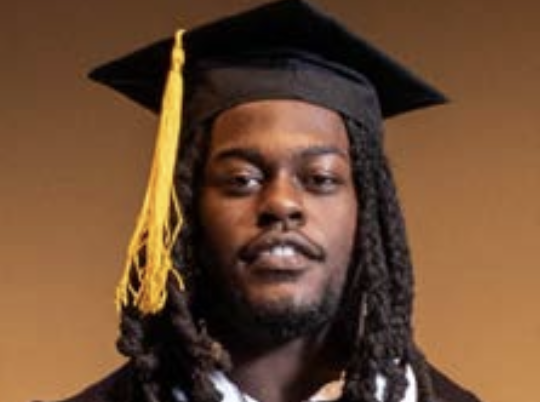 Man in graduation cap & gown