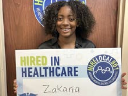 Woman holding sign