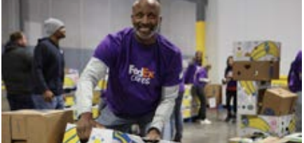 volunteer in FedEx shirt