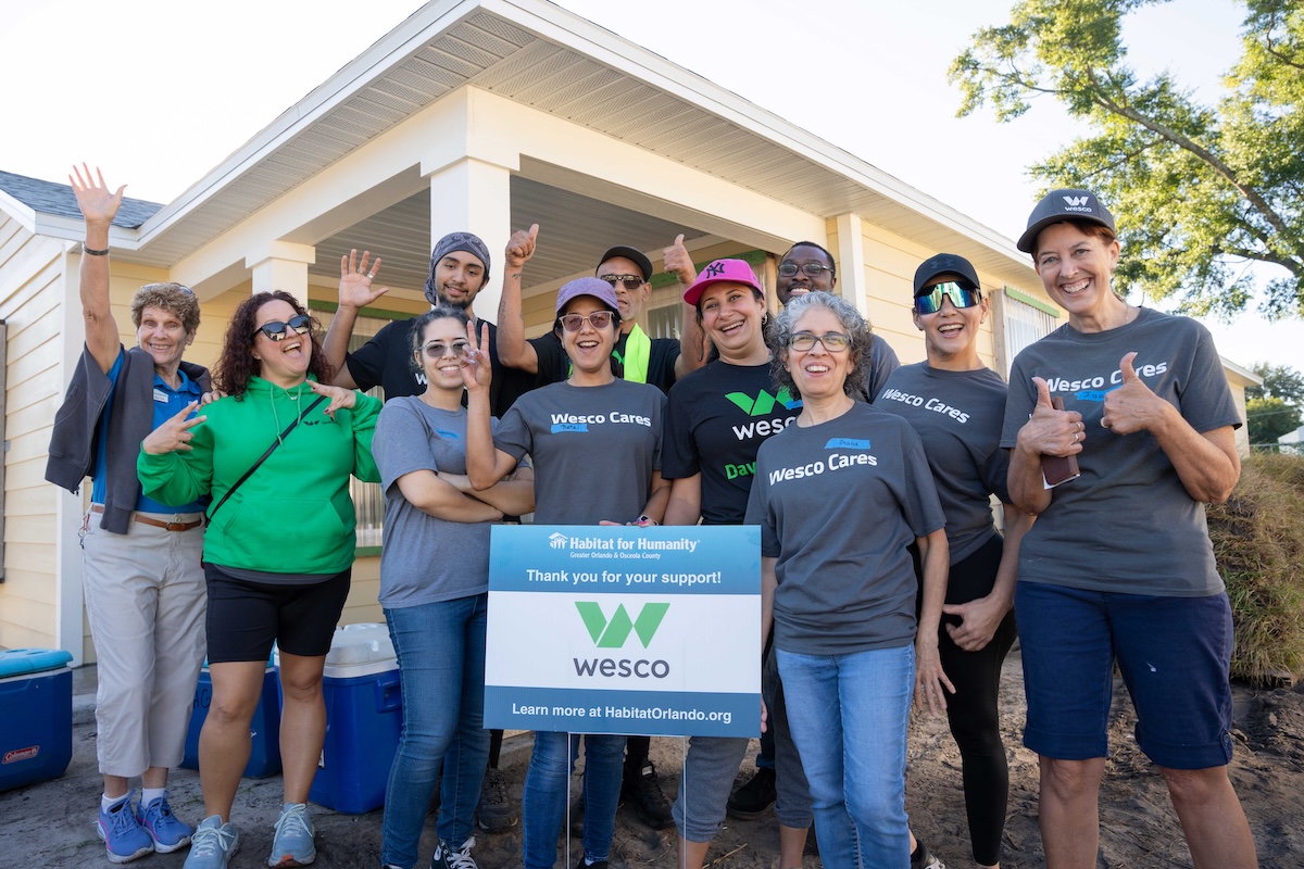 Habitat and Wesco Team at a completed build.