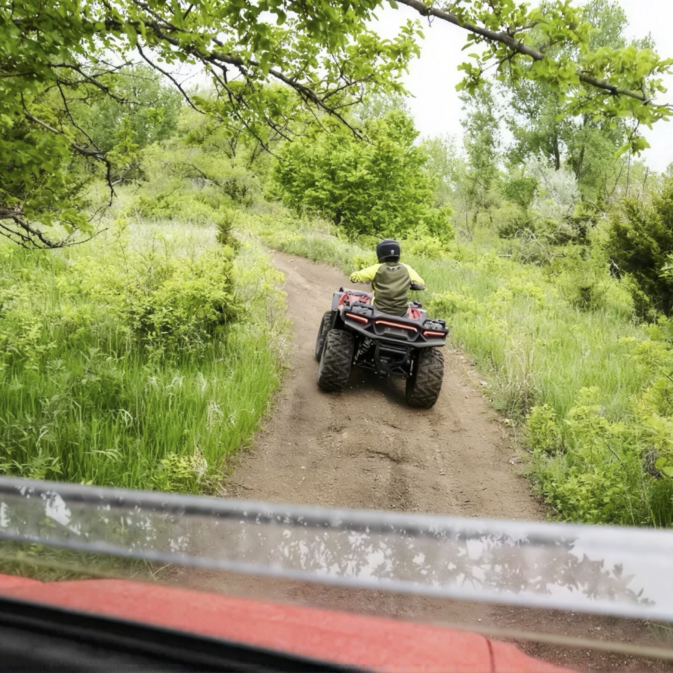 Person riding ATV on trail