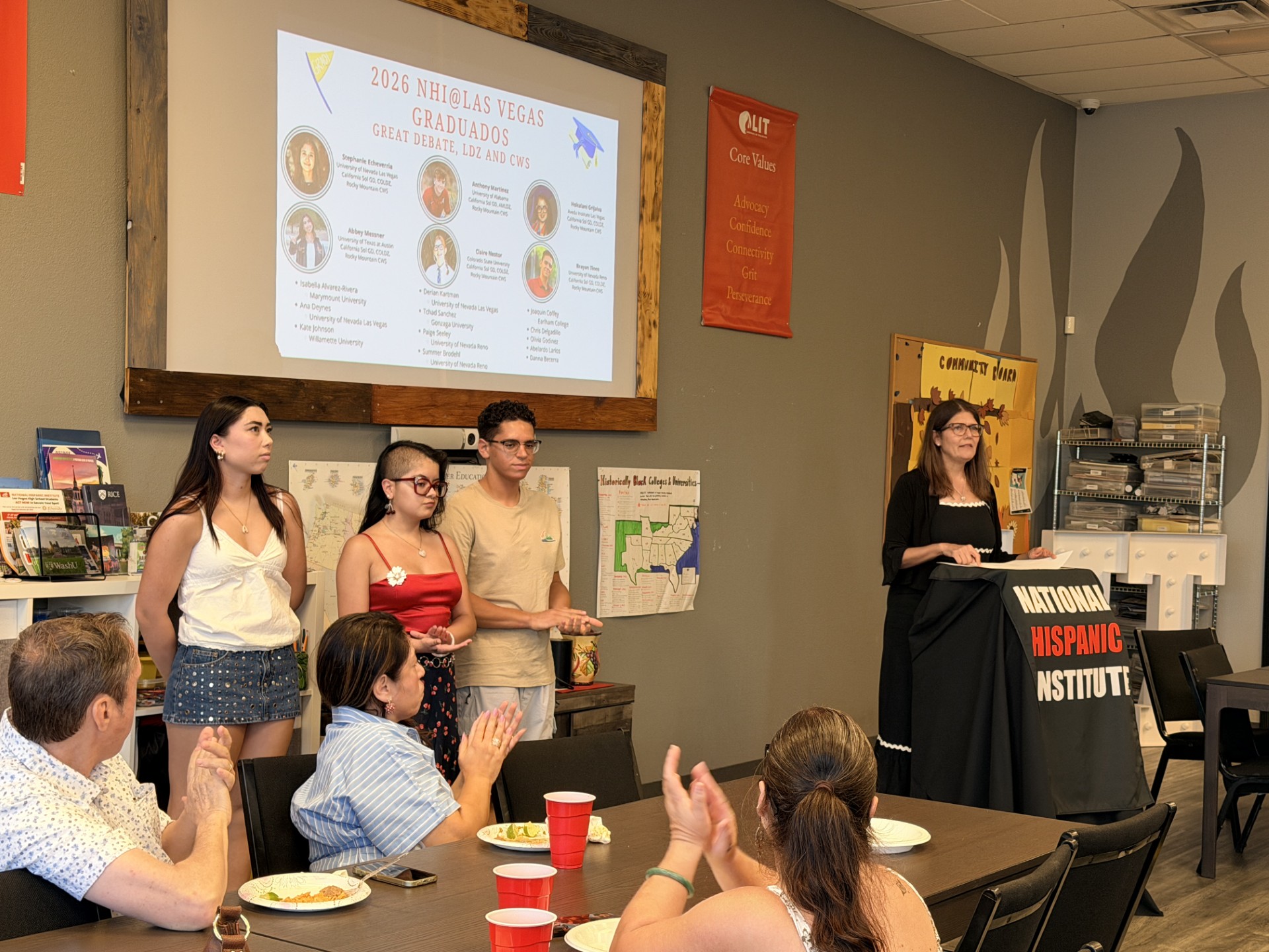 students from program standing at an event