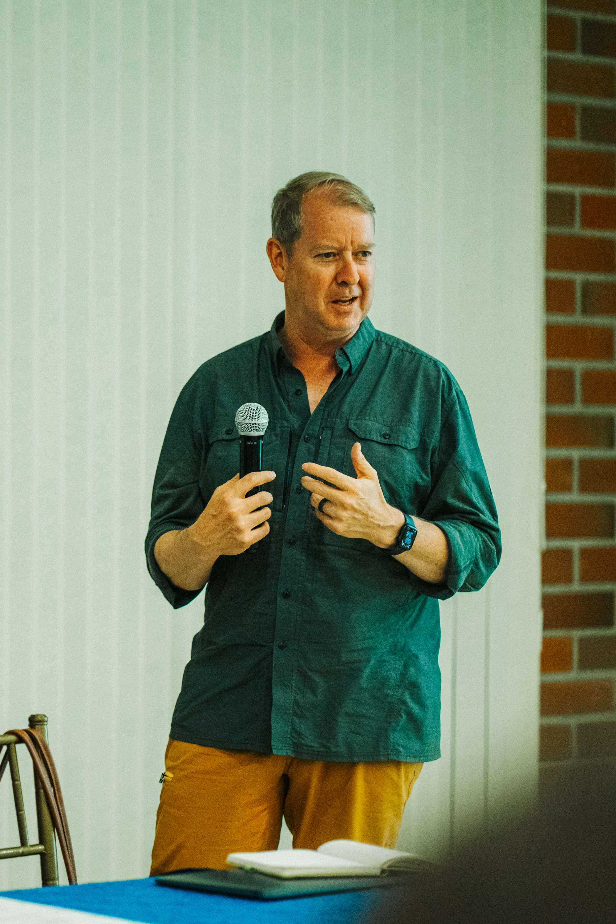person speaking with microphone