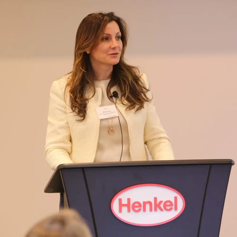 Belma speaking at lectern