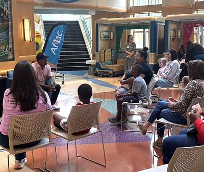 Brian Jordan reading to children.