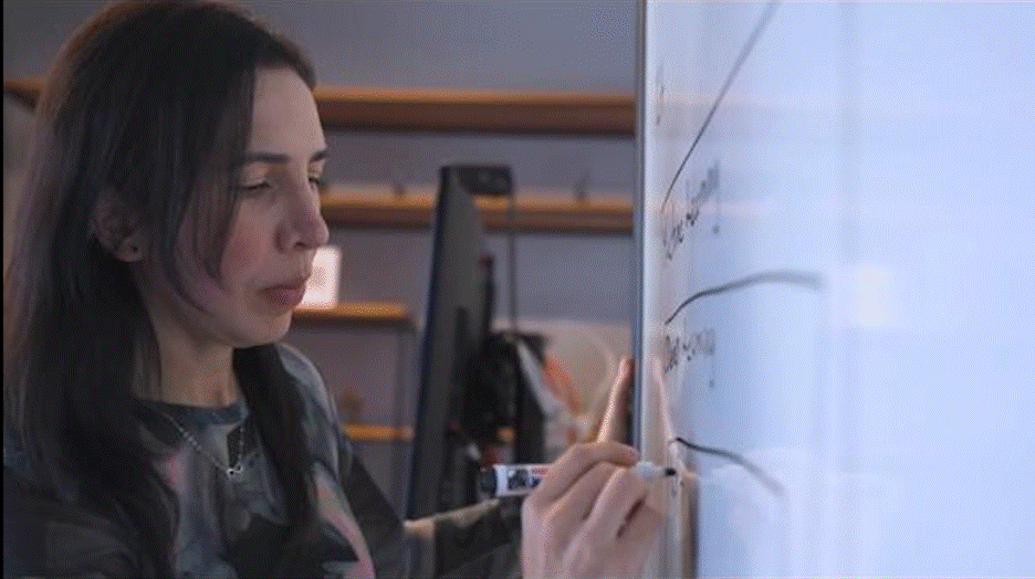 Diana Lopera writing on white board