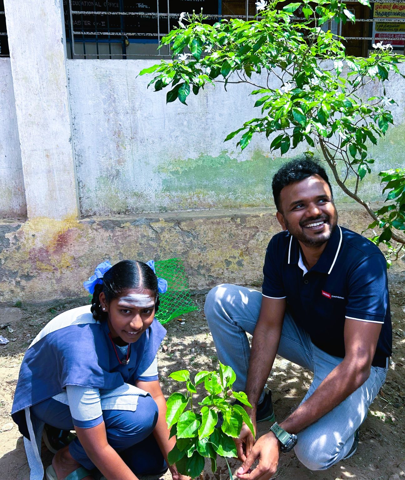 Two people planting trees