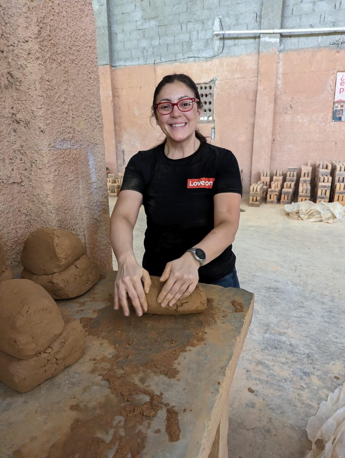 woman rolling clay