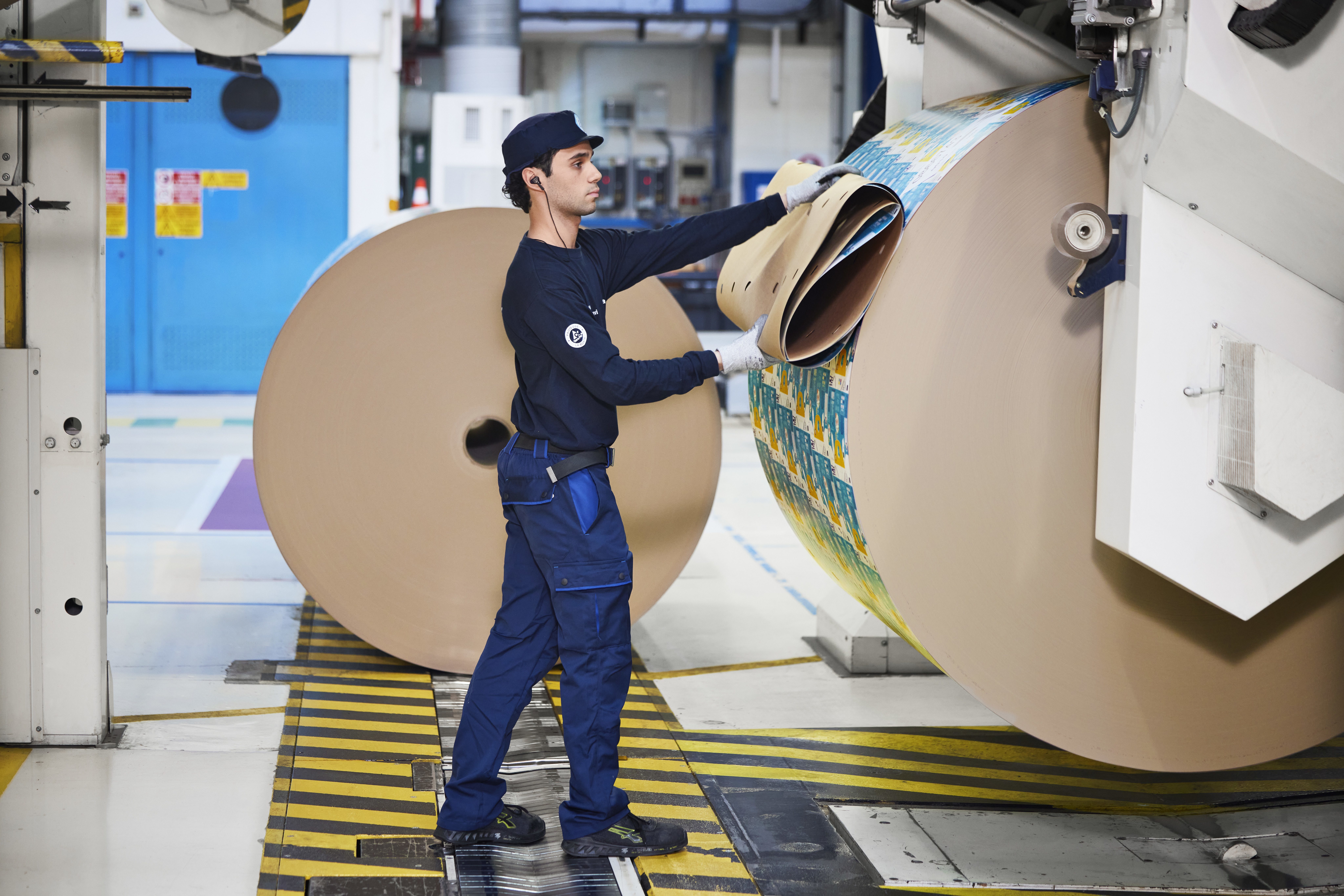 Person working with a large printer