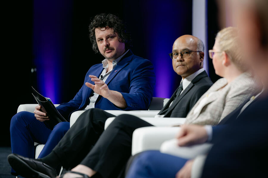 people speaking on a panel