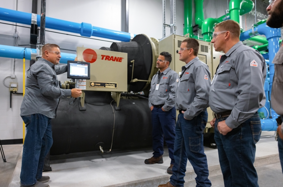 Robert Collins providing technicians instruction on a water-cooled chiller