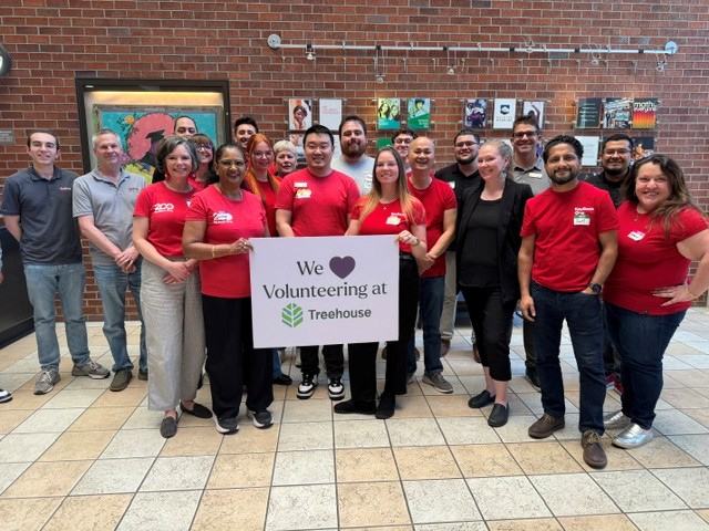 volunteers taking a group picture together