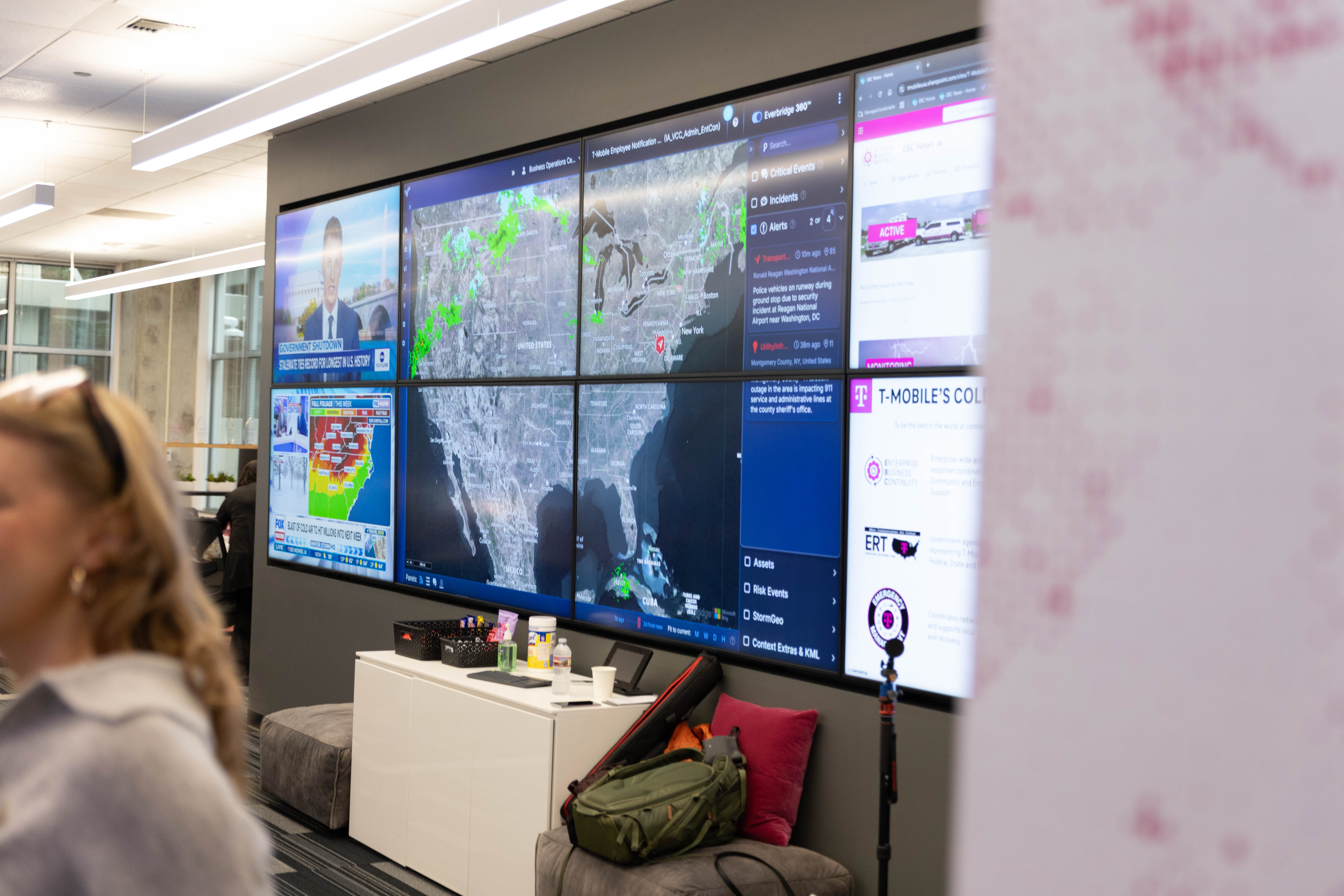 television screens with maps and news