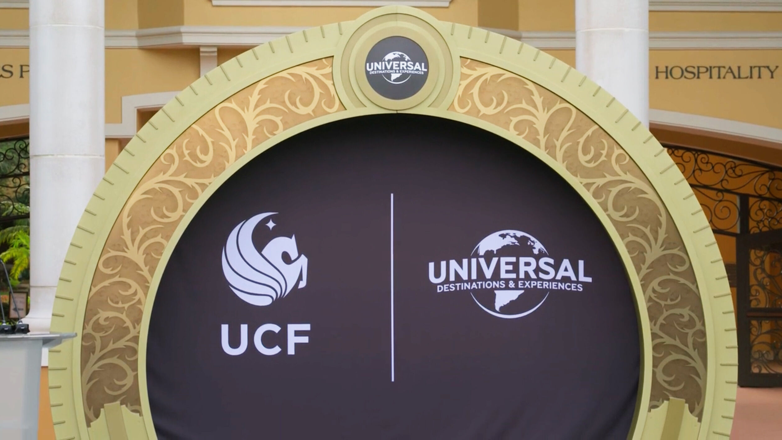Logos for UCF and Universal side by side on building