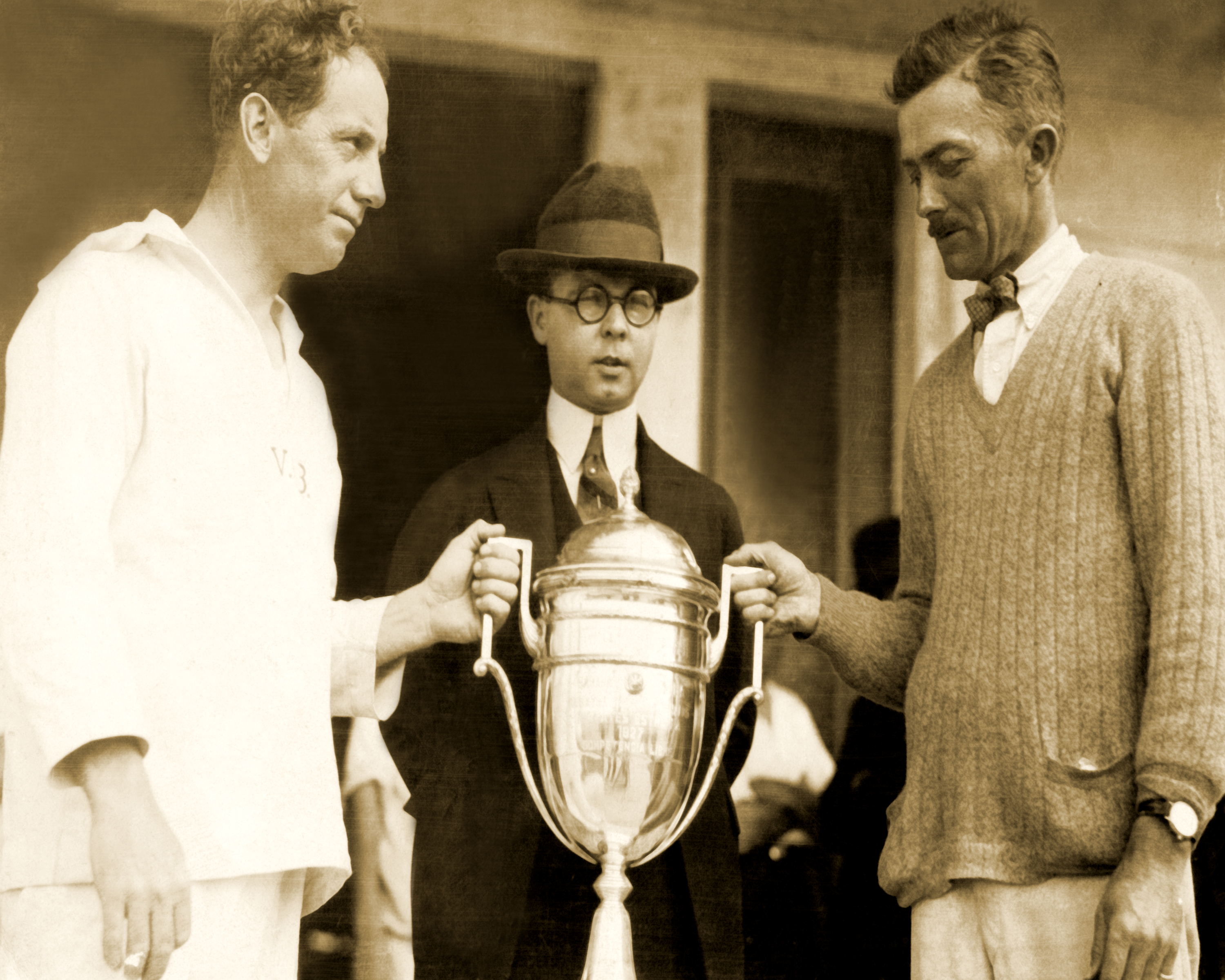 Photo from the Bacardi Archives: The inaugural 1927 Bacardi Cup Trophy is handed to renowned yachtsman Adrian Iselin II (right) and skipper Ed Willis (left).