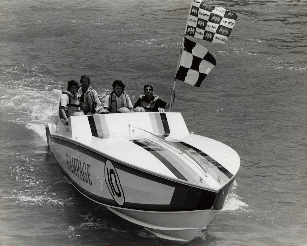 Photo from the Bacardi Archives: Bacardi Family Member and longtime Bacardi Cup Host José ‘Tito’ Argamasilla holds the finish line flag at the 1985 event along Biscayne waters.