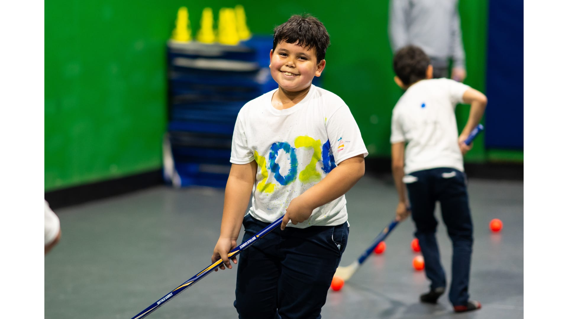 A child with a hockey stick