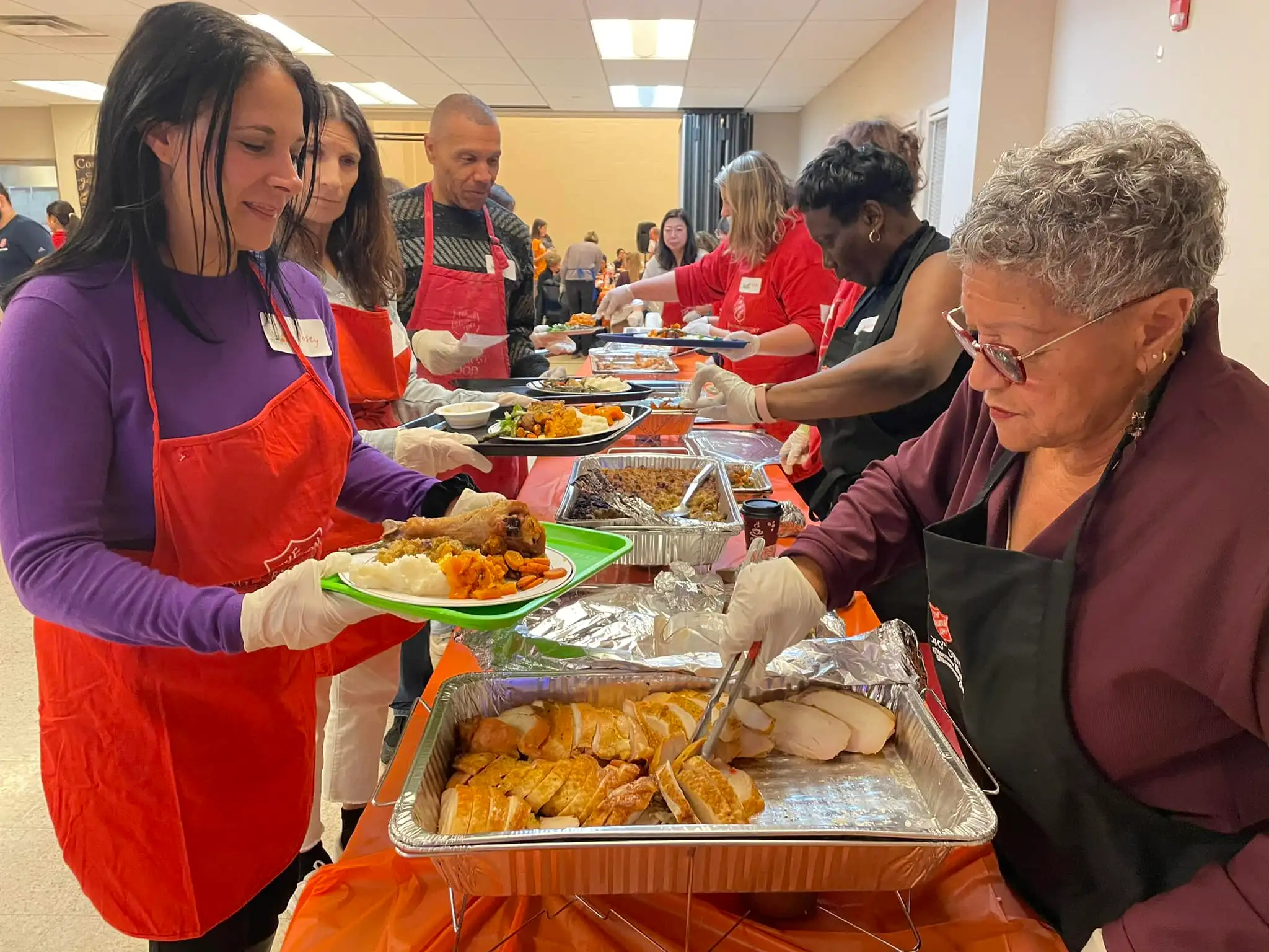 Volunteers serving food