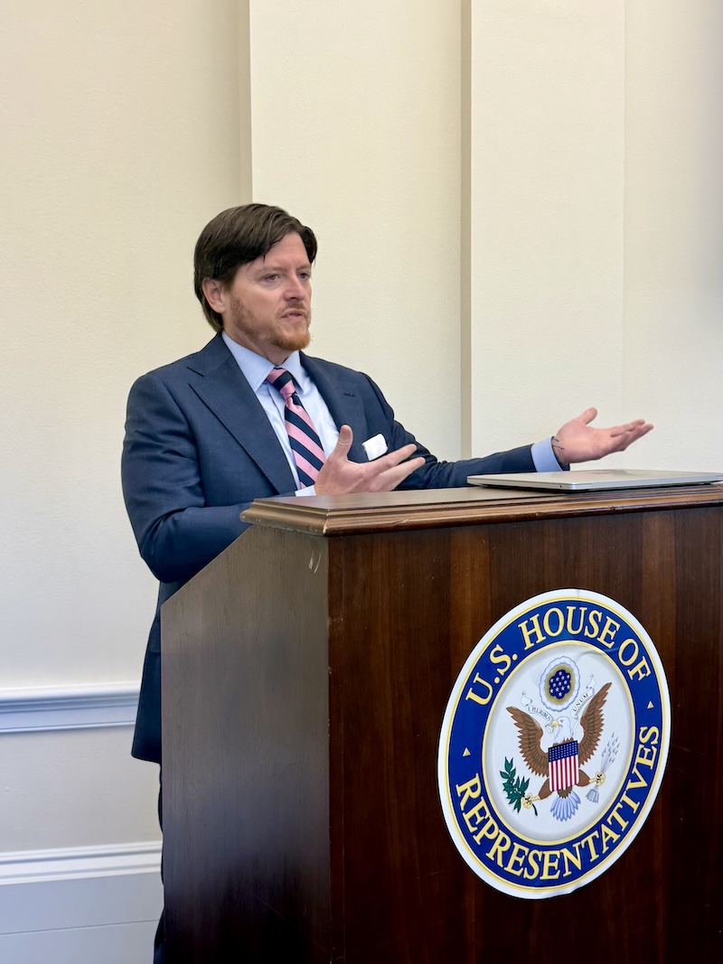 person speaking at podium