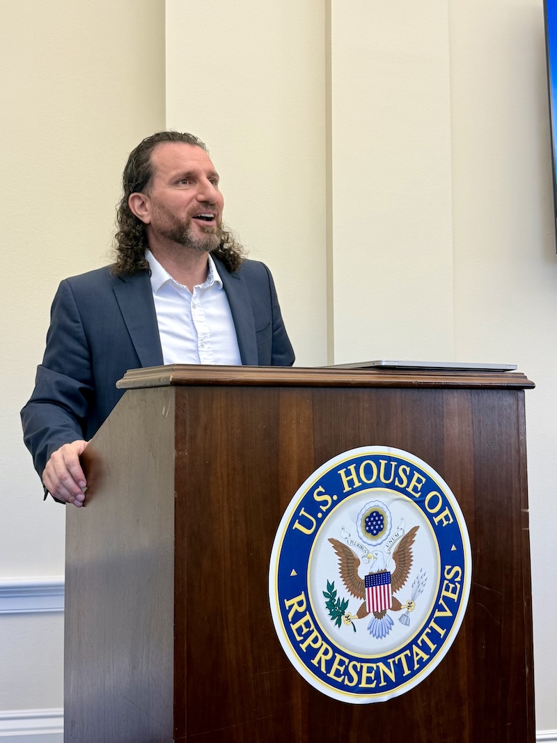 person speaking at podium