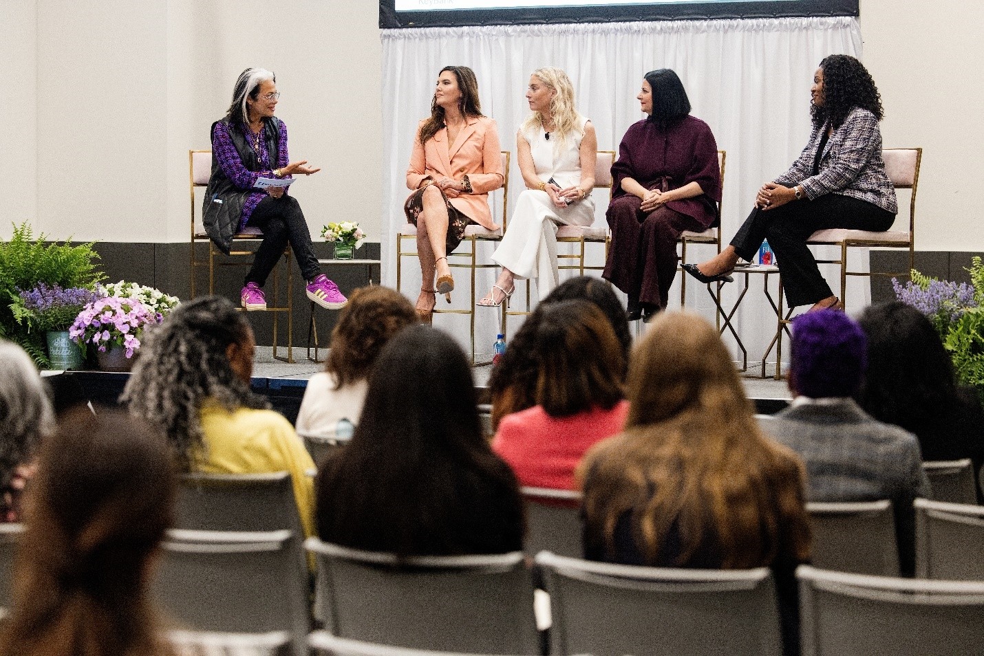 Women on stage during an event