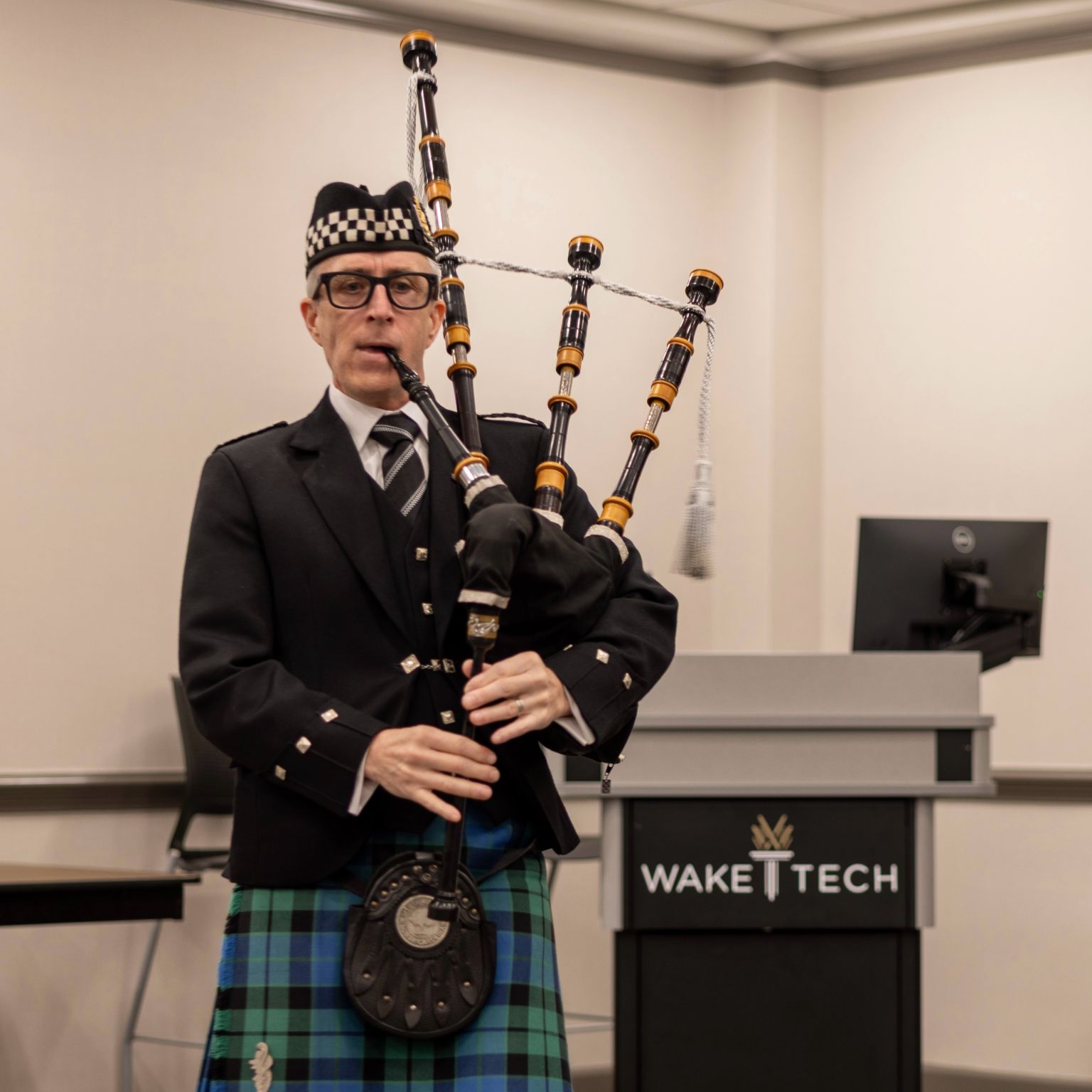 person playing the bag pipes