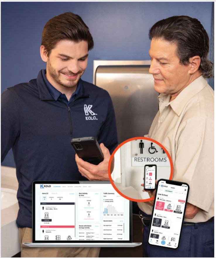 Two people looking at a cell phone