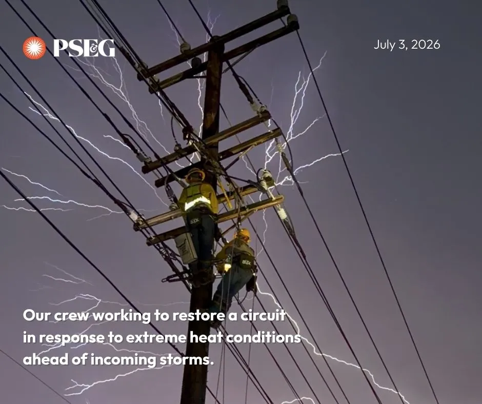 crew working lines with lightning behind them