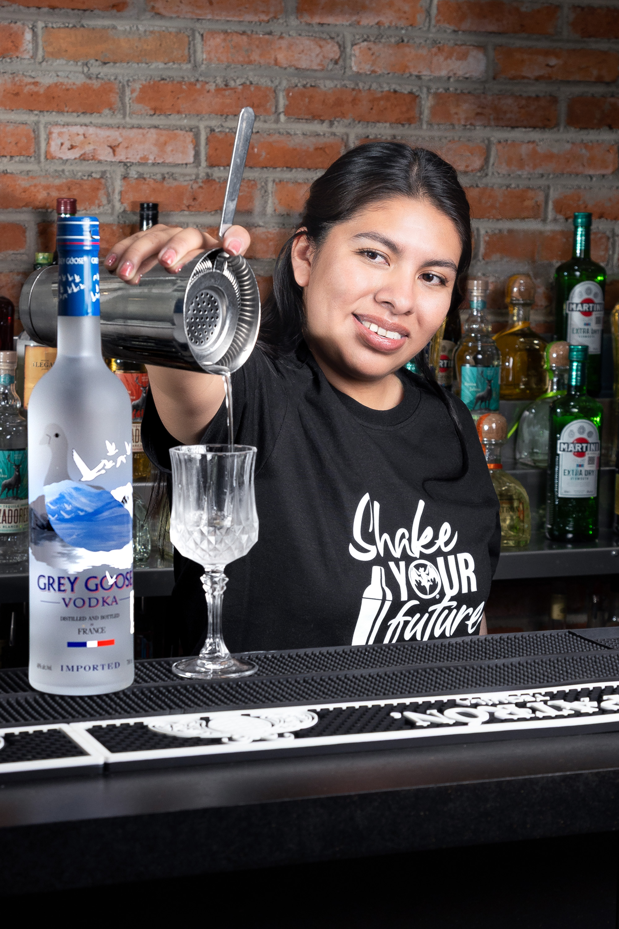 person mixing a drink