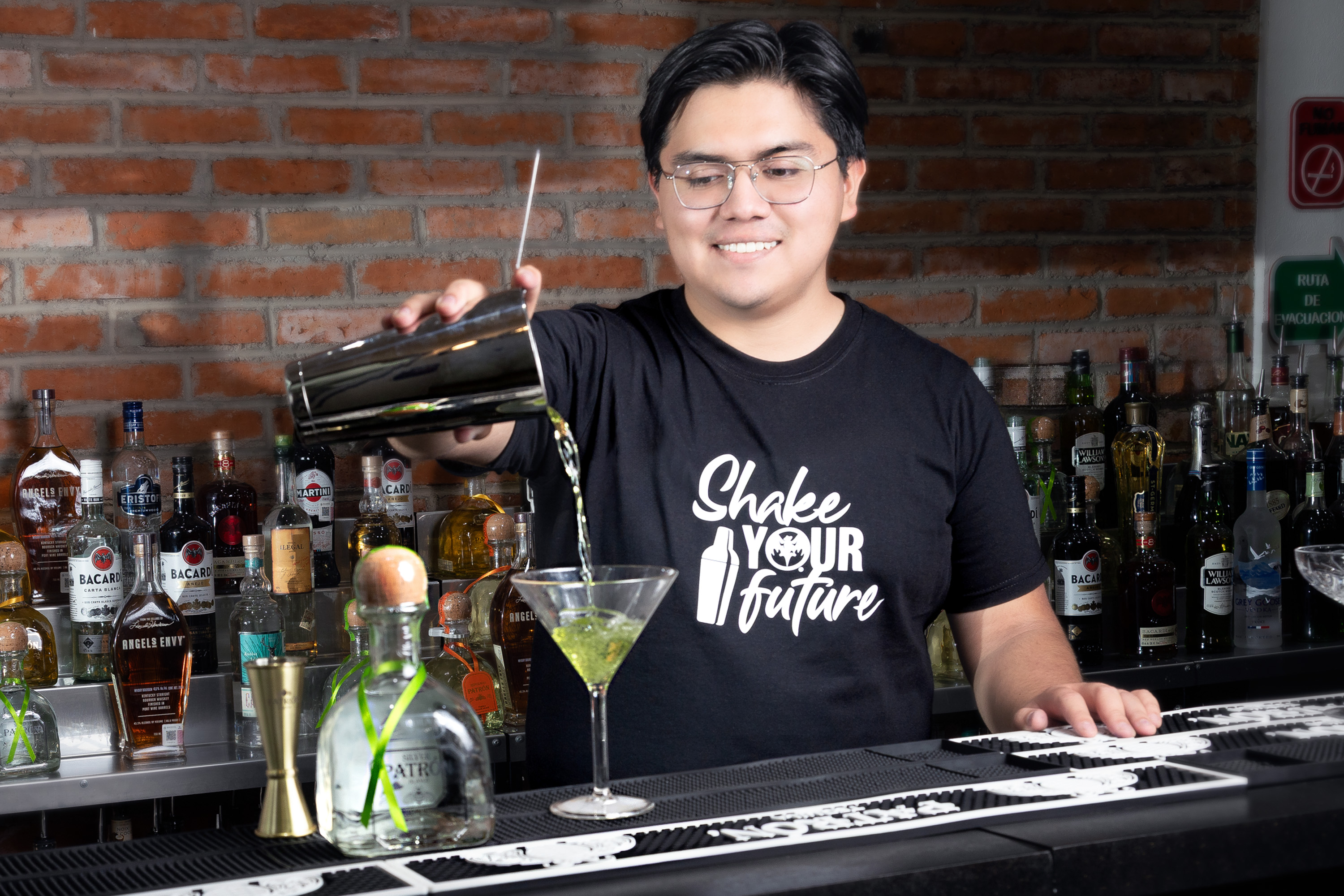 person mixing a drink