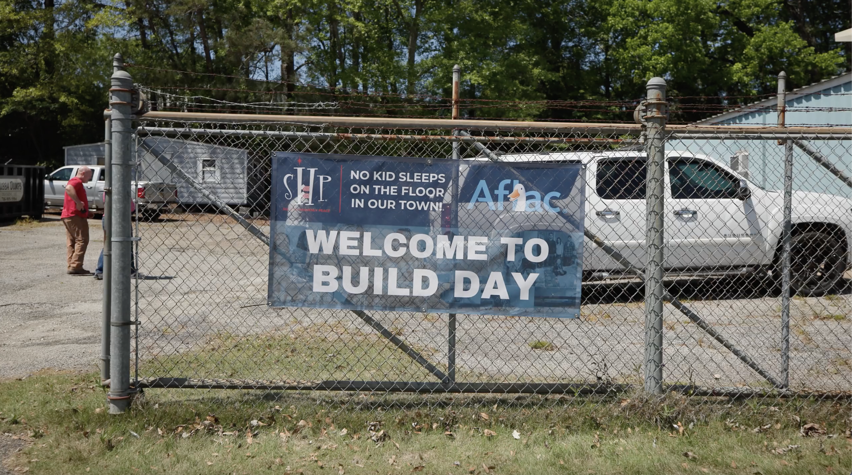 Banner on gate reading "Welcome to Build Day"
