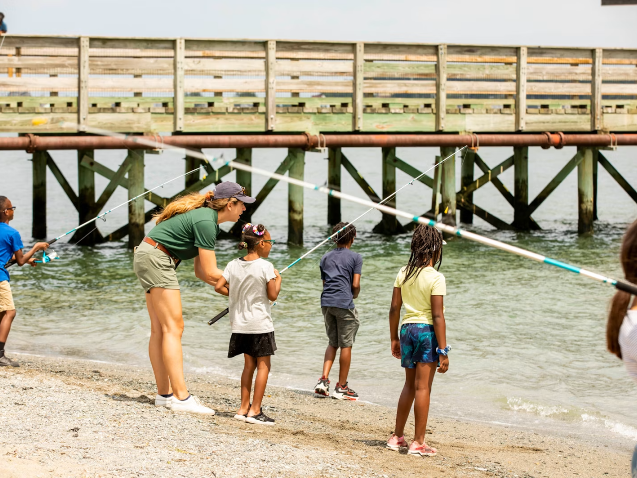 Instructor and kids fishing