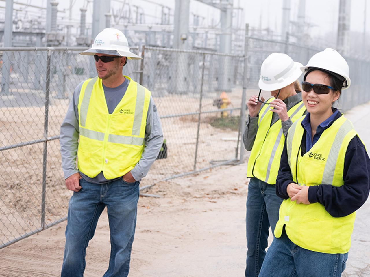 Wen Tong and two colleagues at a substation