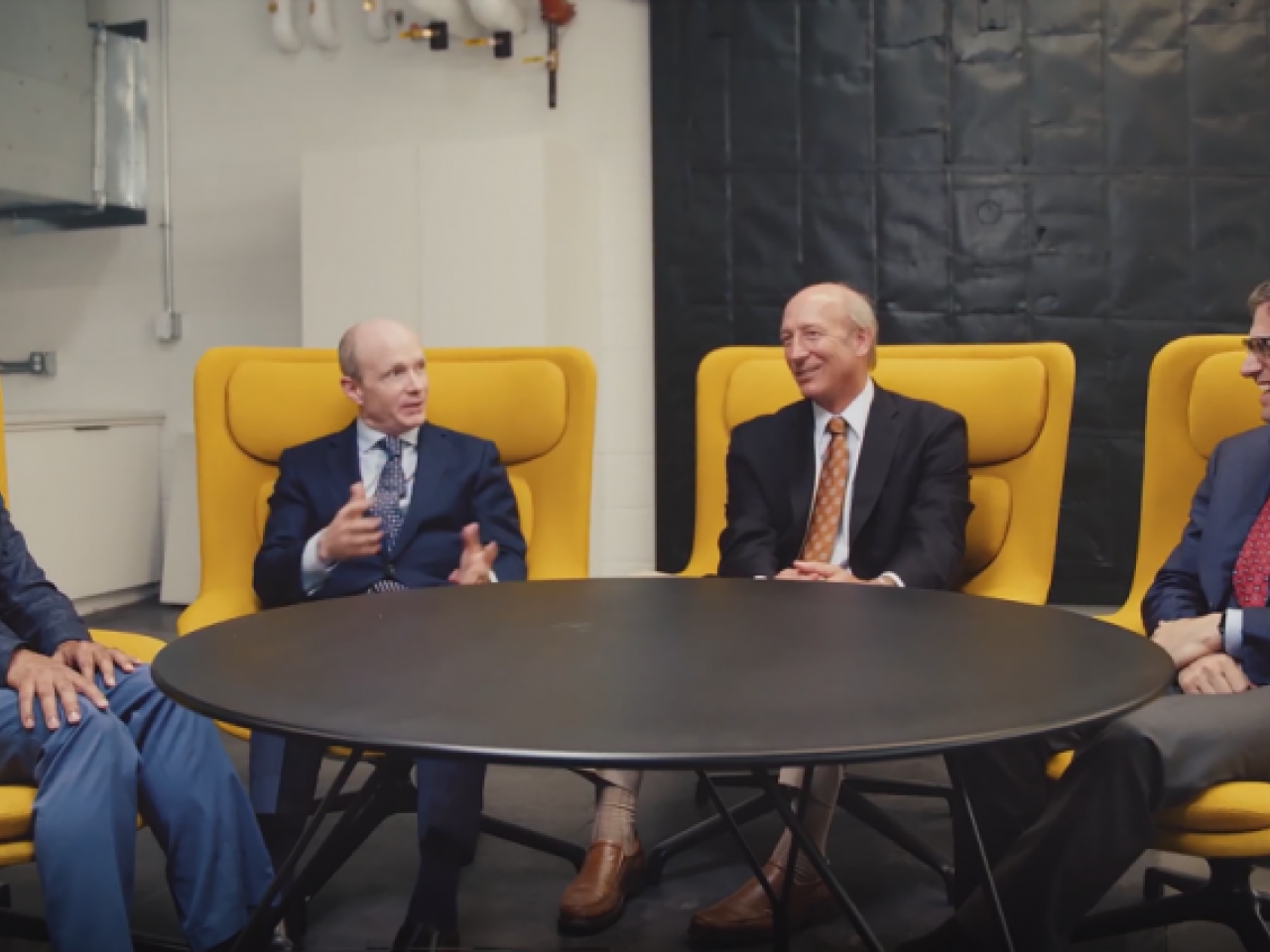 4 people meeting at a table