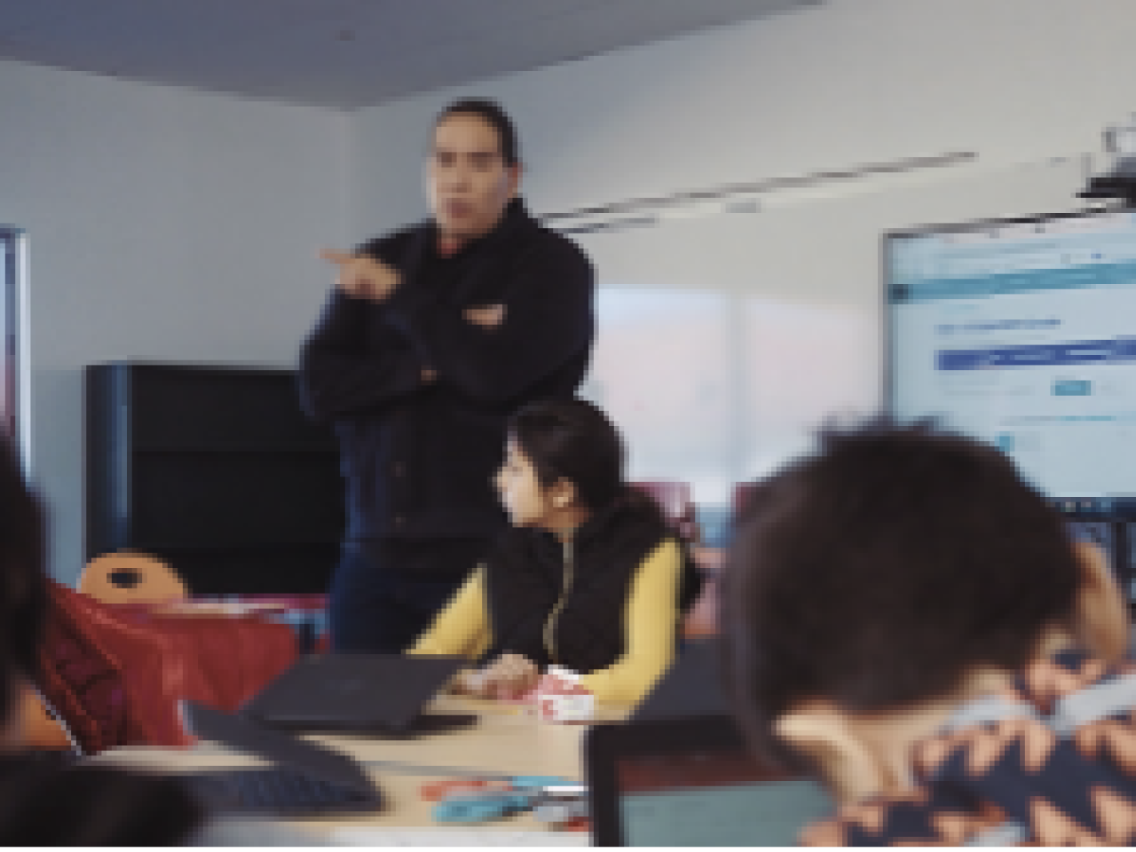 Teacher at the front of the classroom