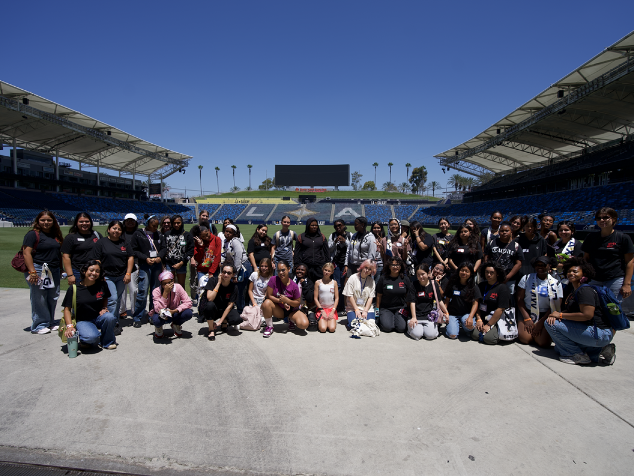 Girls Inc. of Los Angeles participants gather at Dignity Health Sports Park for a group photo during an educational and empowerment experience hosted with the LA Galaxy.