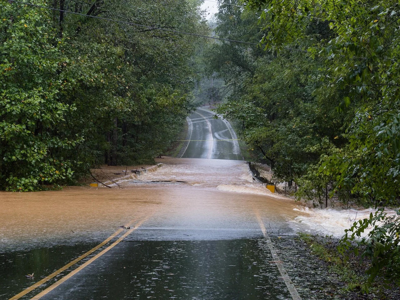 Road washed out by rushing water