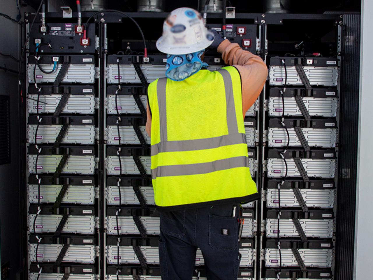 person working on electrical equipment