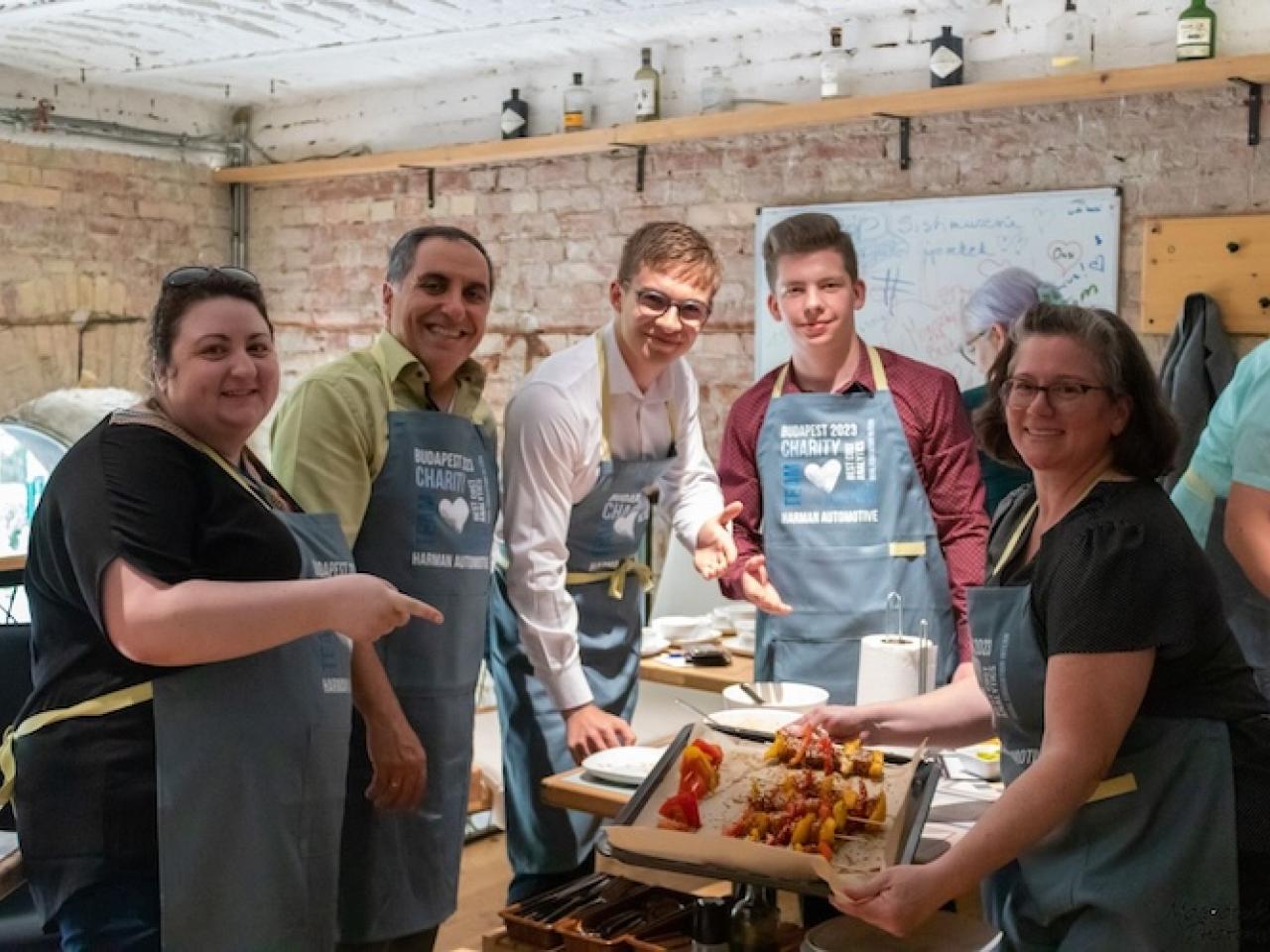 HARMAN volunteers shown preparing meals for the homeless.