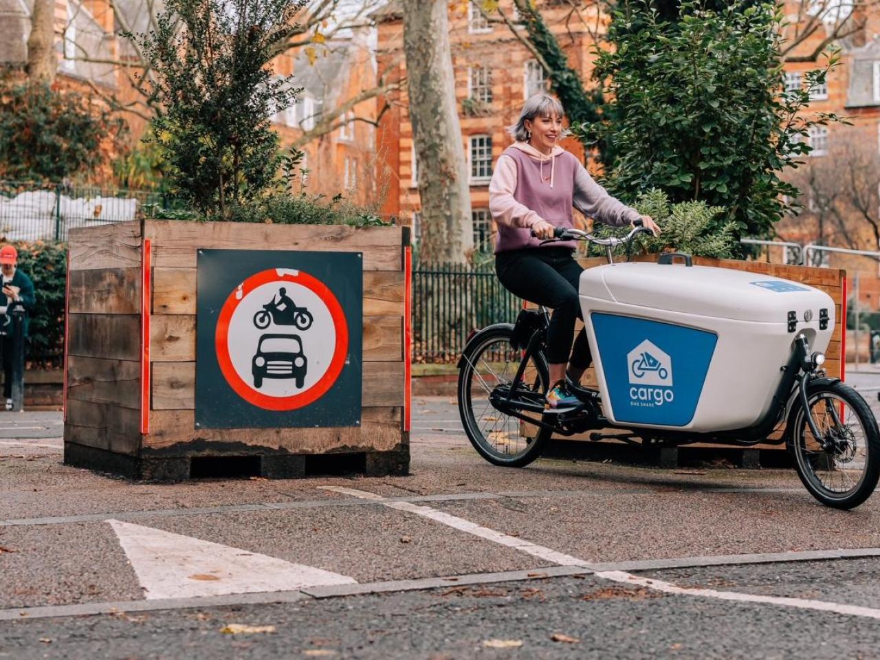 A person riding a cargo bike
