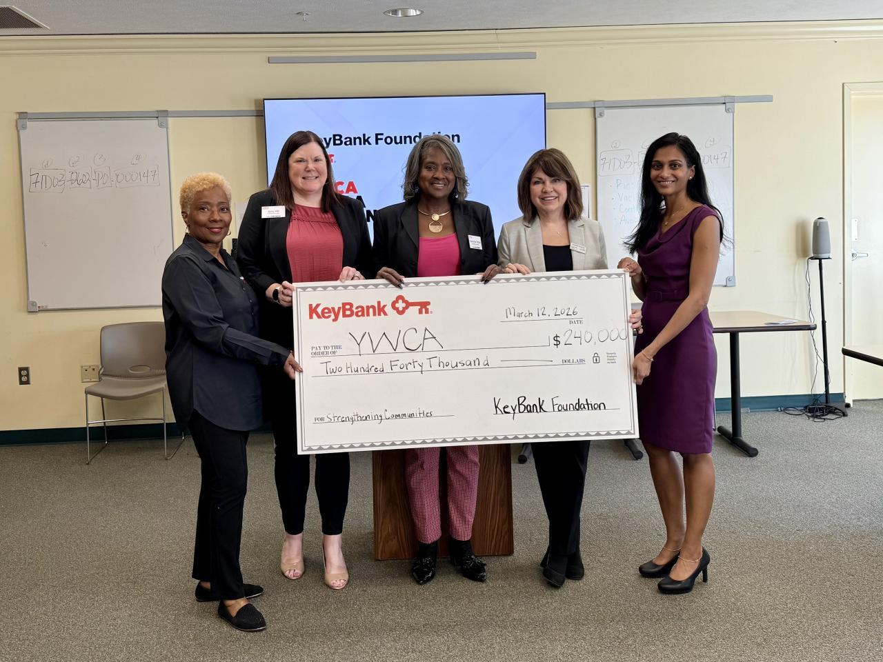 KeyBank and YWCA leadership shown with the grant check.